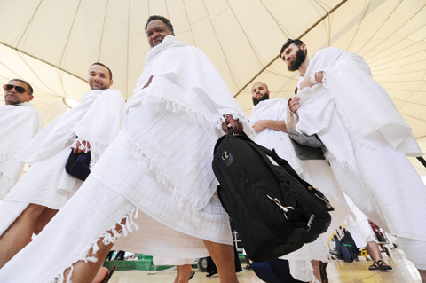 JEDDAH Pilgrims walk outside King Abdul Aziz Airport on their arrival to this Red Sea port city yesterday.- AFP