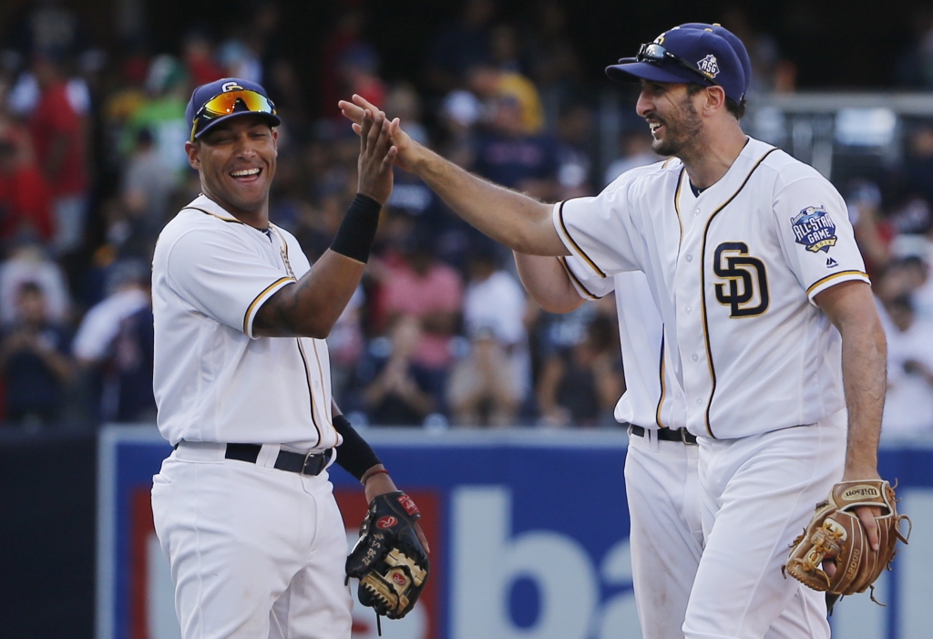 San Diego Padres Adam Rosales right high-fives with Yangervis Solarte after the Padres 2-1 victory over the Boston Red Sox in a baseball game Monday Sept. 5 2016 in San Diego. Rosales hit a two-run home run