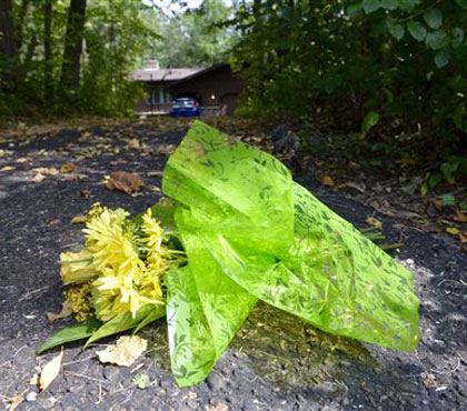 A bouquet of flowers is placed at the end of Jerry and Patty Wetterling's driveway as news has come out that the search for Jacob Wetterling may be over Saturday afternoon Sept. 3 2016 in St. Joseph Minn