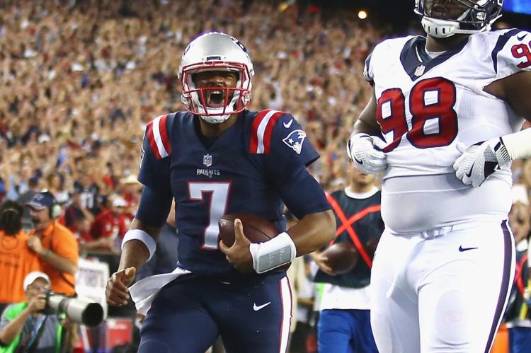 Jacoby Brissett celebrates scoring a touchdown against the Texans