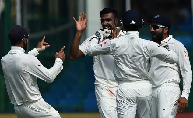 India captain Virat Kohli and Ravichandran Ashwin celebrate the wicket of New Zealand's captain Kane Williamson during the third day of the first