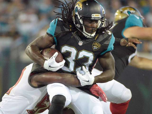 Jacksonville Jaguars running back Chris Ivory is stopped by the Tampa Bay Buccaneers defense after a short gain in the first half of an NFL preseason football game in Jacksonville Fla. The Jaguars expect Ivory to