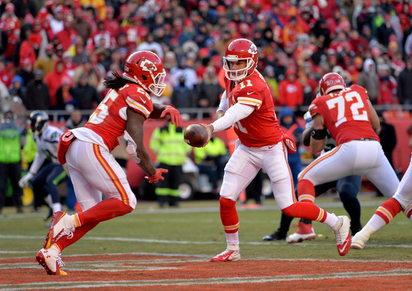 Jamaal Charles taking a handoff from Alex Smith in the backfield