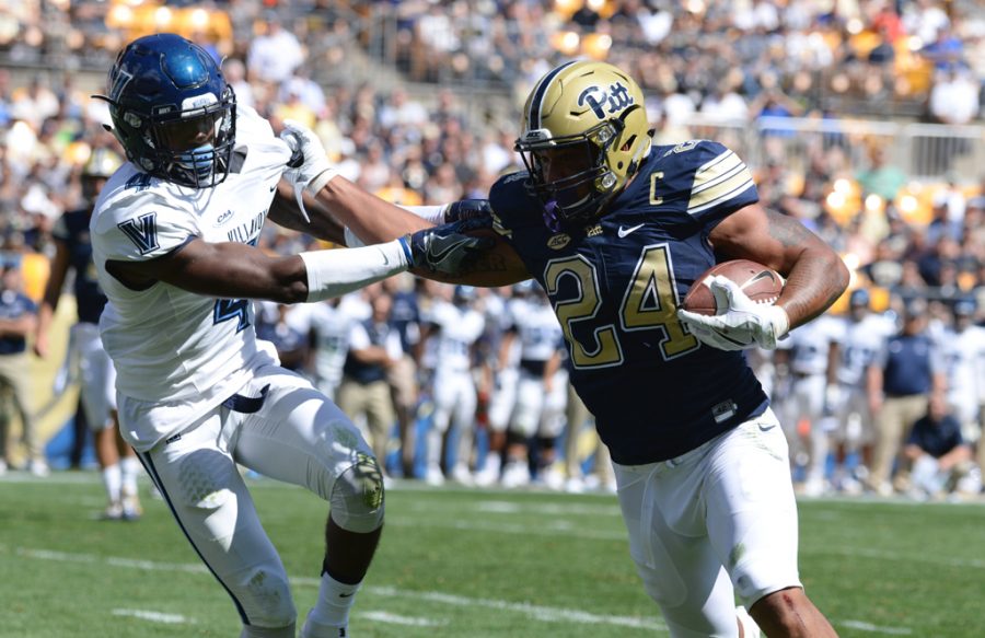 James Conner stiff arms a defender in the second quarter to score the first points of the game. Jeff Ahearn | Senior Staff