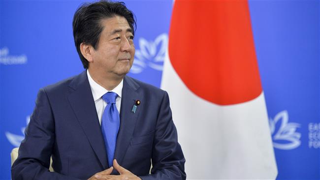 Japanese Prime Minister Shinzo Abe listens to Russian President Vladimir Putin during their meeting in Vladivostok Russia