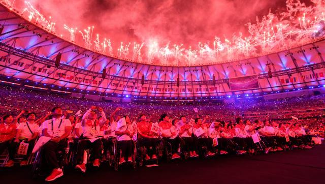 Japanese athletes watch the show during the closing ceremony of the Rio 2016 Paralympic Games