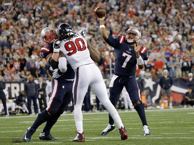 New England Patriots quarterback Jacoby Brissett passes over Houston Texans defensive end Jadeveon Clowney during the second half of an NFL football game Thursday Sept. 22 2016 in Foxborough Mass. The