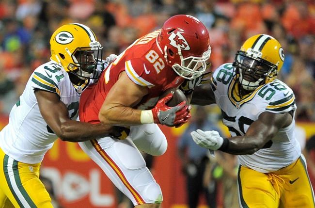 Kansas City Chiefs tight end Brian Parker is tackled by Green Bay Packers linebacker Sam Barrington and cornerback Robertson Daniel left during the first half of an NFL preseason football game in Kansas City Mo. Thursday Sept. 1 2016. (AP