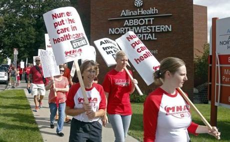 Allina Health nurses protested outside Abbott Northwestern Hospital in Minneapolis on Monday