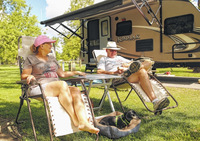 Jim and Sandy Rown of St. Marys start a weekend of camping at the Grand Lake St. Marys State Park campgrounds on Thursday afternoon