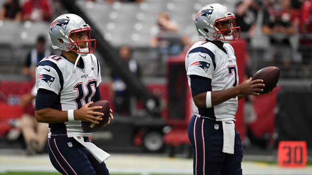 Quarterbacks Jimmy Garoppolo #10 and Jacoby Brissett #7 of the New England Patriots warm up before an NFL game against the Arizona Cardinals at University of Phoenix Stadium