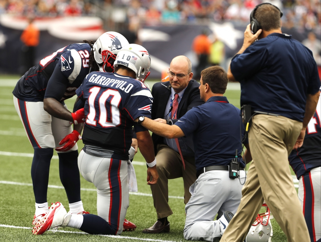 Sep 18 2016 Foxborough MA USA New England Patriots quarterback Jimmy Garoppolo injured after a play against the Miami Dolphins in the first quarter at Gillette Stadium. Mandatory Credit David Butler II-USA TODAY Sports