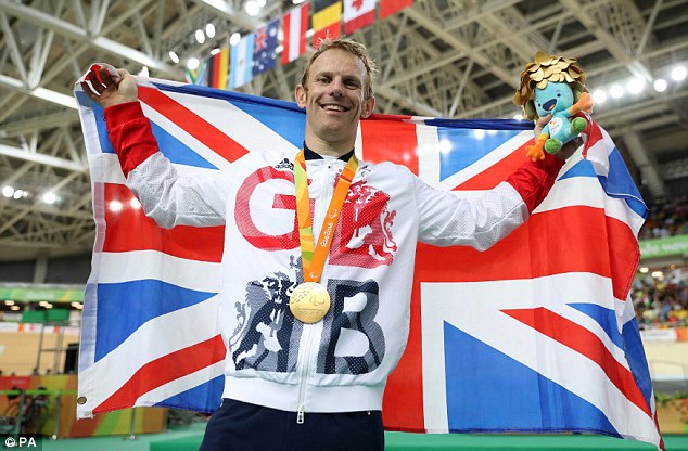 Jody Cundy celebrates on the podium after winning gold in the C4-5 1000m Time Trial in Rio