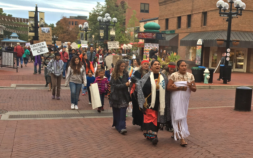 Joel Dyer Protesters march on Boulder Colorado's Pearl Street Mall in opposition to the Dakota Access pipeline