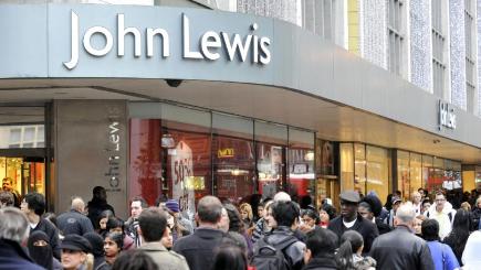 John Lewis said its commitment to competitive pricing increasing pay and investment held back profits in the six months to July 30