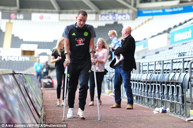 John Terry leaves the Liberty Stadium on crutches following Sunday's draw with Swansea