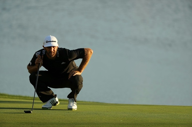 Dustin Johnson of the US lines up a putt on the 17th green during the third round of the BMW Championship at Crooked Stick Golf Club in Carmel Indiana