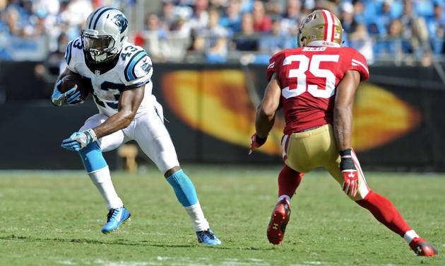 Carolina Panthers&#039 Fozzy Whittaker runs past San Francisco 49ers&#039 Eric Reid in the second half of an NFL football game in Charlotte N.C. Sunday Sept. 18 2016