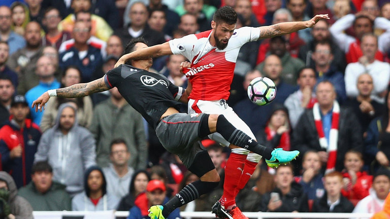 Jose Fonte grabs Olivier Giroud's shirt in the late penalty incident at the Emirates