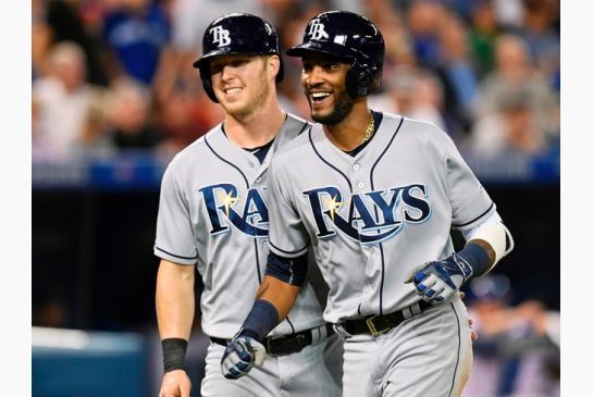 Tampa Bay Rays Corey Dickerson left congratulates teammate Alexei Ramirez on his three-run home run against the Toronto Blue Jays during fifth inning American League baseball action in Toronto on Tuesday Sept.13 2016. THE CANADIAN PRESS  Frank Gunn