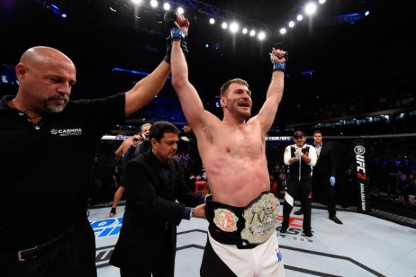 Josh Hedges  Zuffa LLC      Miocic celebrating victory