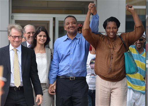 Darryl Howard with his wife Nannie right leave the Durham County Detention Center victorious with their lawyers and family after a judge threw out Howard's conviction in a double-murder case tried 21 years ago and ordered Howard's release because of DNA