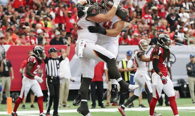 Tampa Bay Buccaneers tight end Brandon Myers left celebrates his touchdown reception with Ali Marpet during the first half of an NFL football game against the Atlanta Falcons in Atlanta Sunday Sept. 11 2016. The Buccaneers beat the Falcons 31-24. (C