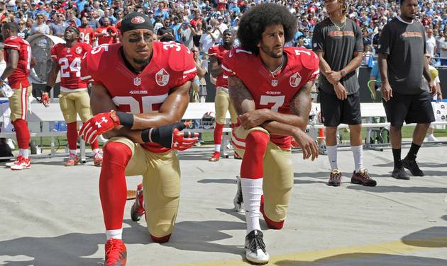 San Francisco 49ers&#039 Colin Kaepernick and Eric Reid kneel during the national anthem before an NFL football game against the Carolina Panthers in Charlotte N.C. Sunday Sept. 18 2016