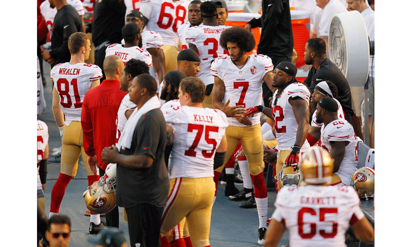 San Francisco 49ers quarterback Colin Kaepernick greets players after taking a knee during the national anthem before a preseason game against the San Diego Chargers on Thursday Sept. 1 2016 at Qualcomm Stadium in San Diego. K.C. Alfred San Diego