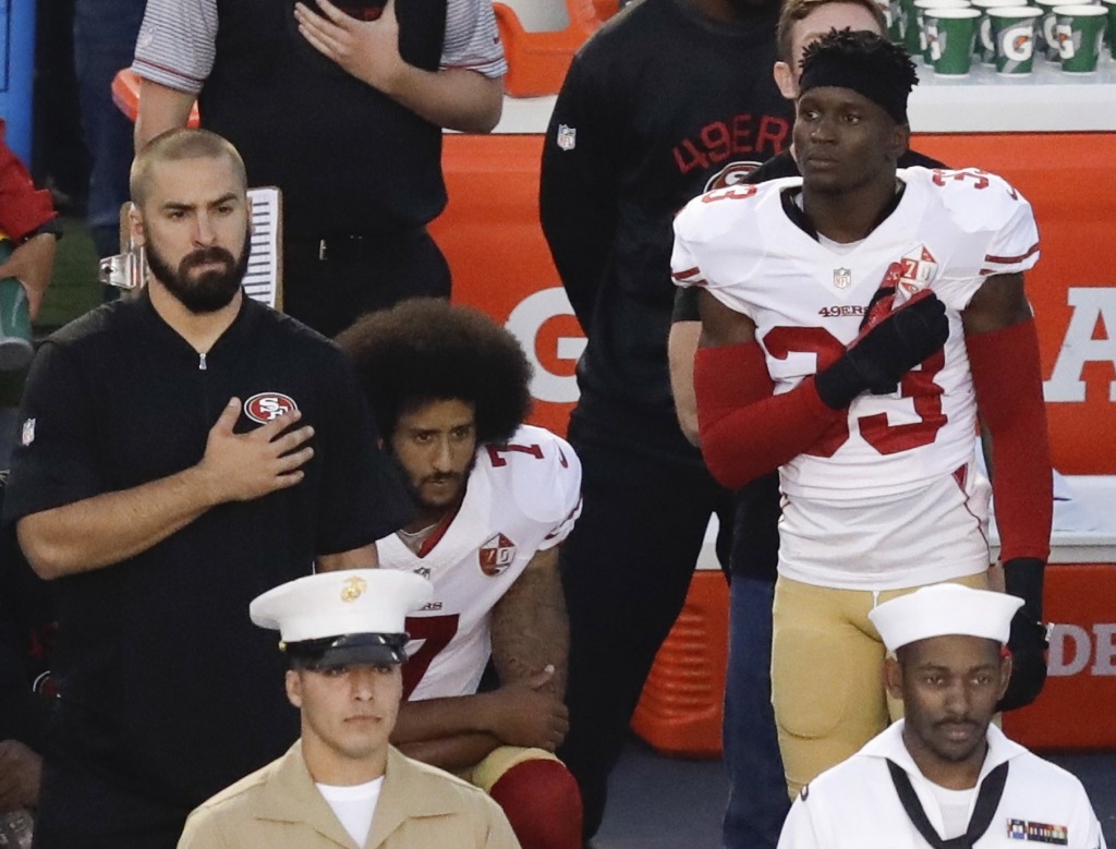 Kaepernick takes a knee during the national anthem on Sept