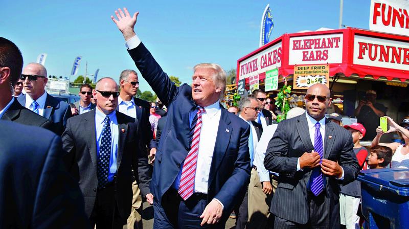 Republican presidential candidate Donald Trump waves during a visit to the170th Canfield Fair in Ohio