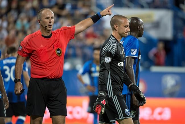 Montreal Impact goalkeeper Evan Bush is thrown out of the game on a red card by referee Ricardo Salazar as they face the Orlando City FC during second half MLS action Wednesday