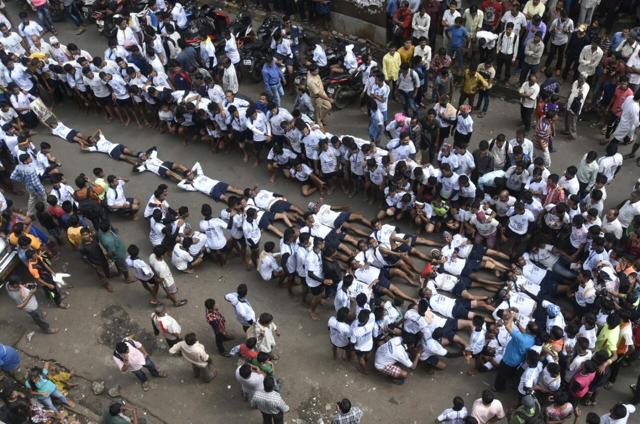 Kakannagar Govinda mandal forming pramind lying down on the ground at Dadar Mumbai