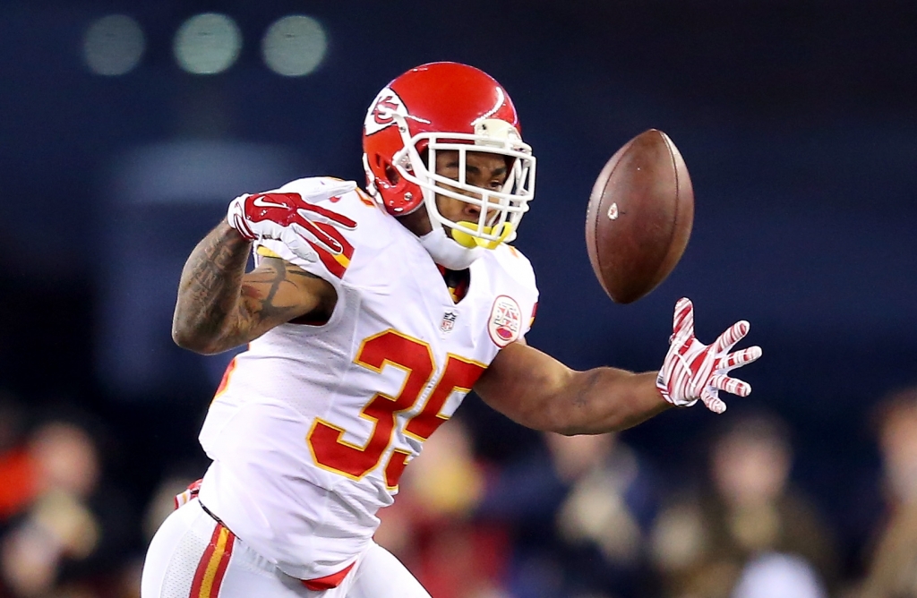 FOXBORO MA- JANUARY 16 Charcandrick West #35 of the Kansas City Chiefs struggles to make a catch in the first half against the New England Patriots during the AFC Divisional Playoff Game at Gillette Stadium