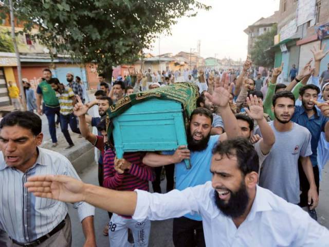 Kashmiri men carry the coffin of Abdul Qayoom who was beaten by Indian police and succumbed to his injuries at a hospital