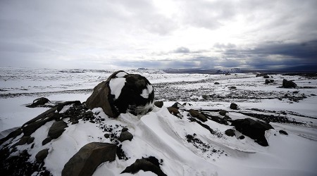 Volcanic boulders sit atop the Myrdalsjokull glacier which is part of the ice cap sealing the Katla volcano near the Icelandic village of Vik