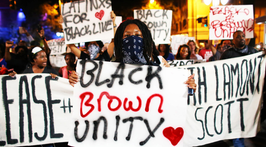 Protesters march in the streets during another night of protests over the police shooting of Keith Scott in Charlotte North Carolina