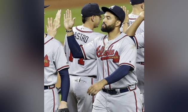 Atlanta Braves&#039 Matt Kemp high fives teammates after a 6-3 win against the Miami Marlins baseball game Thursday Sept. 22 2016 in Miami