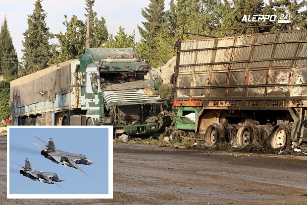 This image provided by the Syrian anti-government group Aleppo 24 news shows damaged trucks carrying aid in Aleppo Syria Tuesday Sept. 20 2016. A U.N. humanitarian aid convoy in Syria was hit by airstrikes Monday as the Syrian military declared that