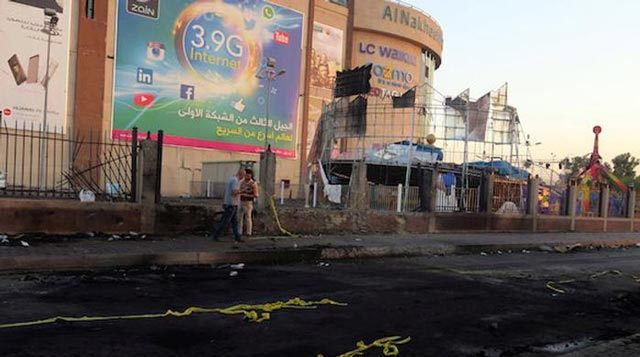 Two bomb blasts outside a shopping mall in central Baghdad claimed by the Islamic State group killed at least 13 people security and medical officials said on Saturday