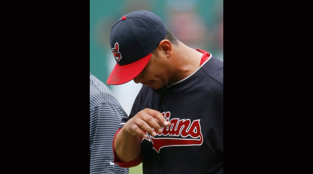 Cleveland Indians starting pitcher Carlos Carrasco walks off the field after suffering a broken right hand when he was hit by a ball off the bat of Detroit Tigers&#039 Ian Kinsler during the first inning of a baseball game Saturday Sept. 17 2016 in Cl