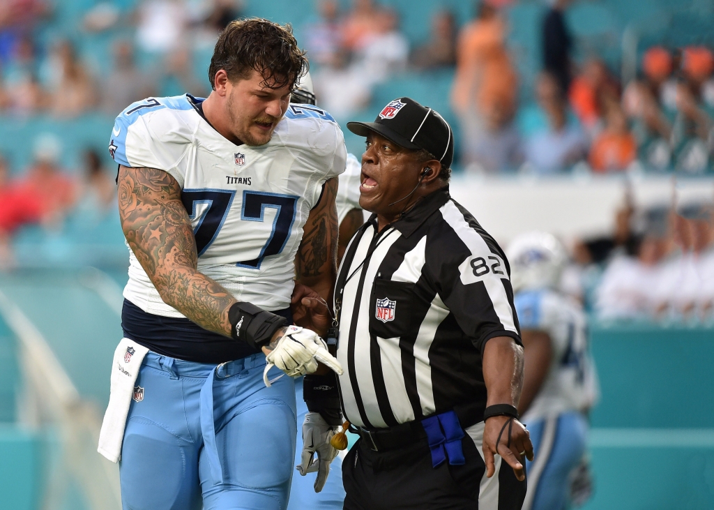 Sep 1 2016 Miami Gardens FL USA Tennessee Titans tackle Taylor Lewan talks with field judge Buddy Horton during a game against the Miami Dolphins at Hard Rock Stadium. Tennessee won 21-10. Mandatory Credit Steve Mitchell-USA TODAY Sports