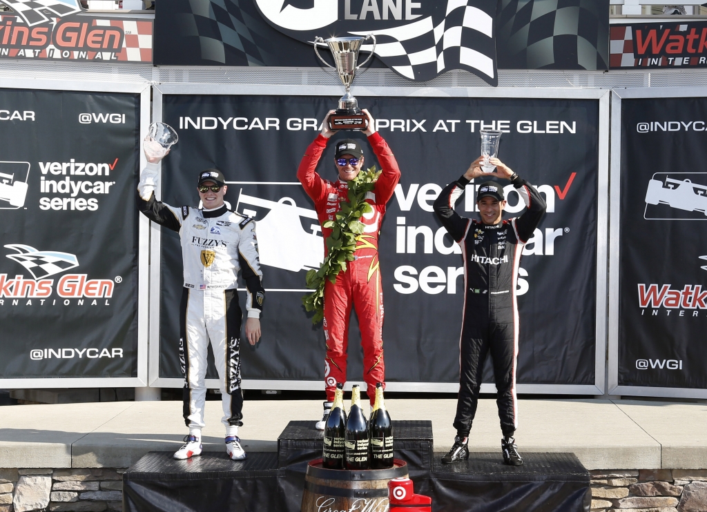 Watkins Glen winner Scott Dixon center second-place finisher Josef Newgarden left and third-place finisher Helio Castroneves celebrate Sunday in victory lane