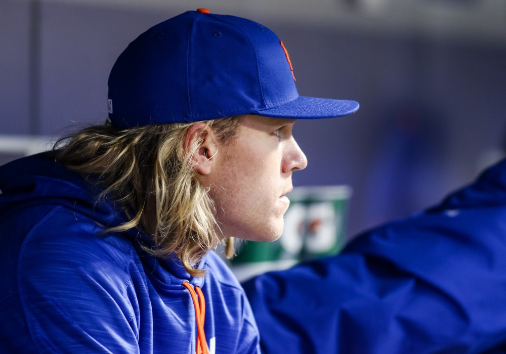 New York Mets Starting pitcher Noah Syndergaard  looks on from the dugout during the game between Miami Marlins and the New York Mets at Citi Field in Flushing NY