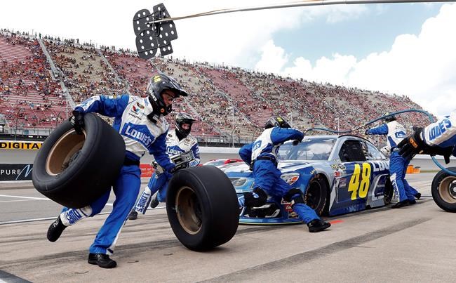 Jimmie Johnson pits during the NASCAR Sprint Cup Series auto race at Michigan International Speedway in Brooklyn Mich. Sunday Aug. 28 2016