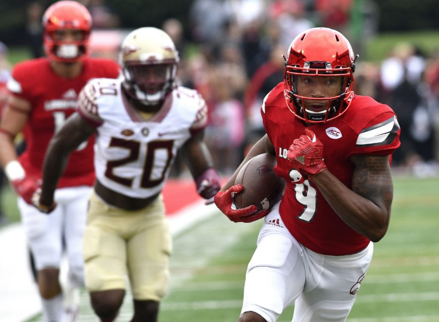 Louisville's Jaylen Smith outruns Florida State's Trey Marshall during NCAA football action Saturday