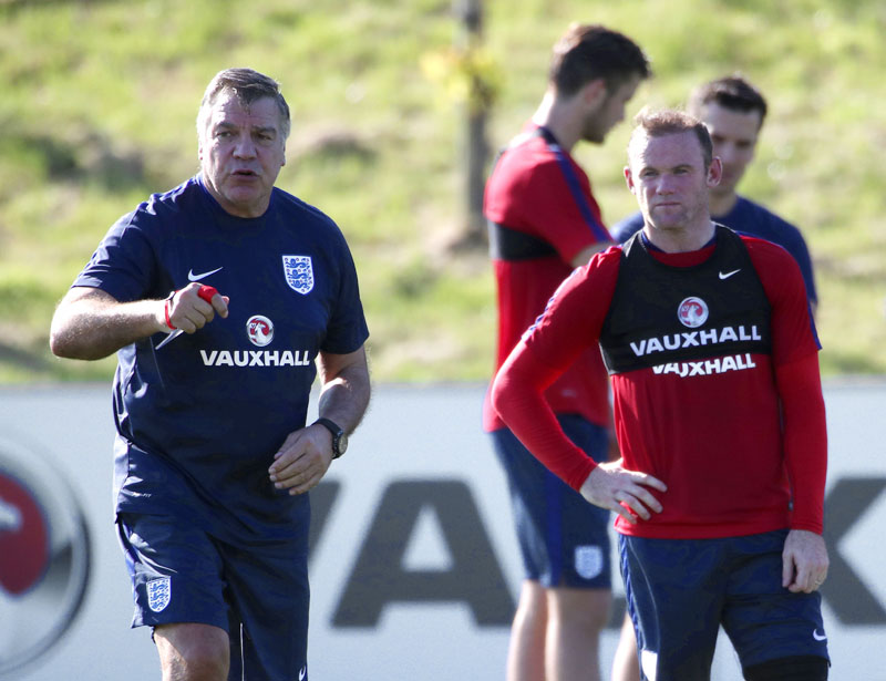 England manager Sam Allardyce and player Wayne Rooney attend a training session at St George's Park Burton England on Tuesday