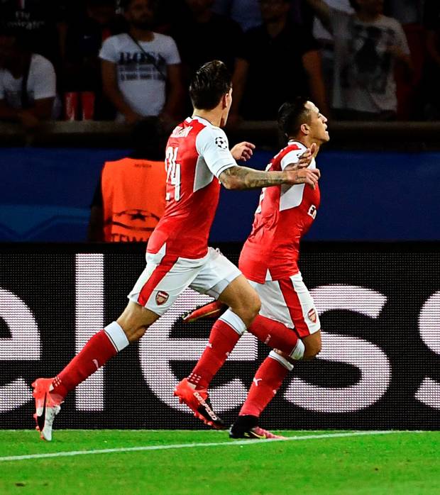 Late show Alexis Sanchez wheels away in celebration after striking to earn Arsenal a valuable point against PSG in France