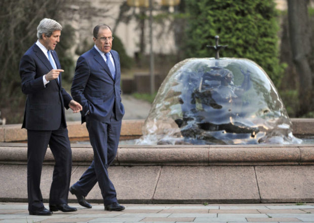 Russia's Foreign Minister Sergei Lavrov right and U.S. Secretary of State John Kerry talk during their meeting in Moscow