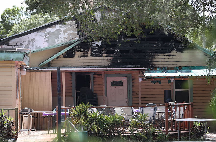 Law enforcement officials investigating a fire at the Islamic Center of Fort Pierce in Fort Pierce Florida Sept. 12 2016